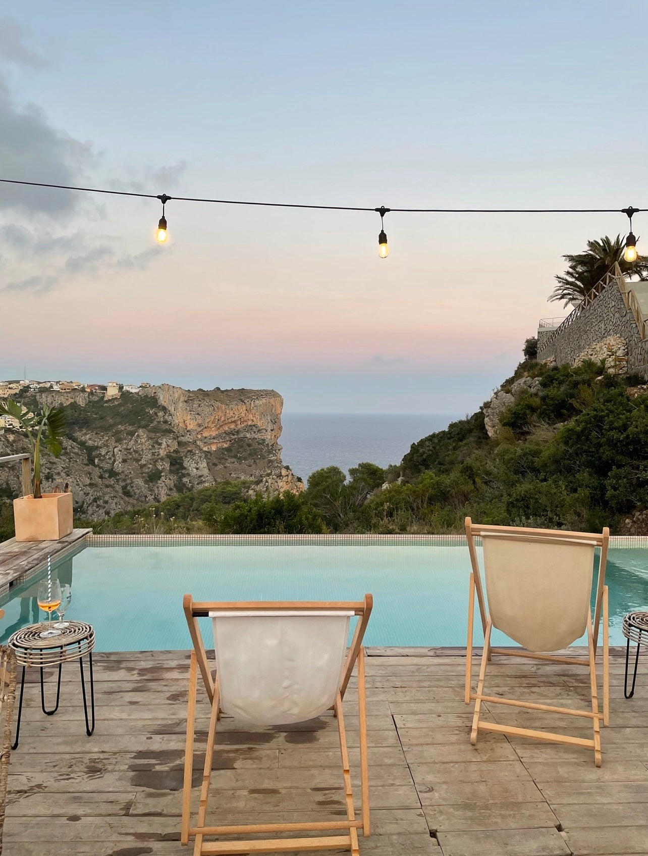 The Mediterranean Surf Camp, featuring a stunning view of the pool with the Mediterranean Sea in the background, offering a relaxing and picturesque atmosphere.